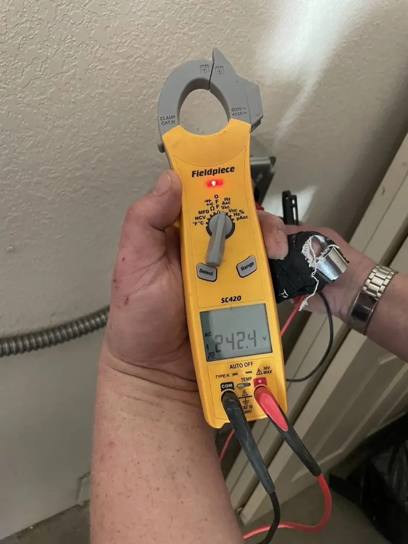 Voltage testing with clamp meter during Circuit Breaker Repair in North Kensington